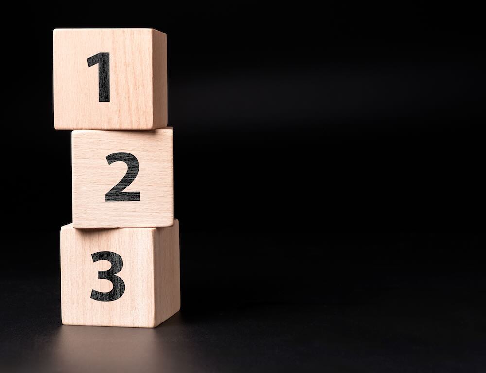 Numbered blocks from 1 to 3 standing on top of each other 